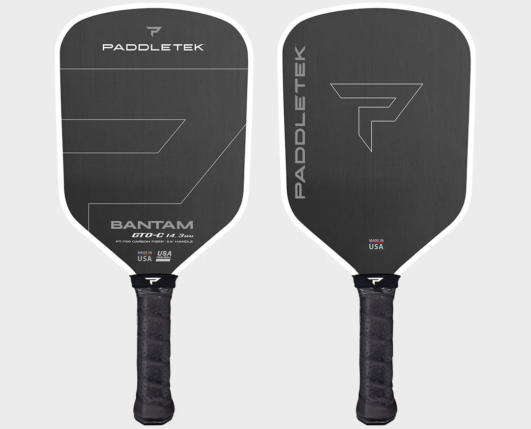 Two black Paddletek pickleball paddles on a white background