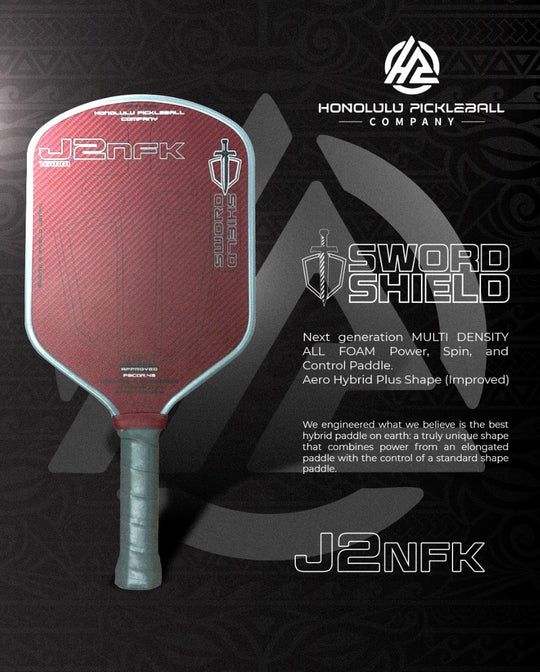 Red pickleball paddle with gray handle on a black background, featuring Honolulu Pickleball Company branding.