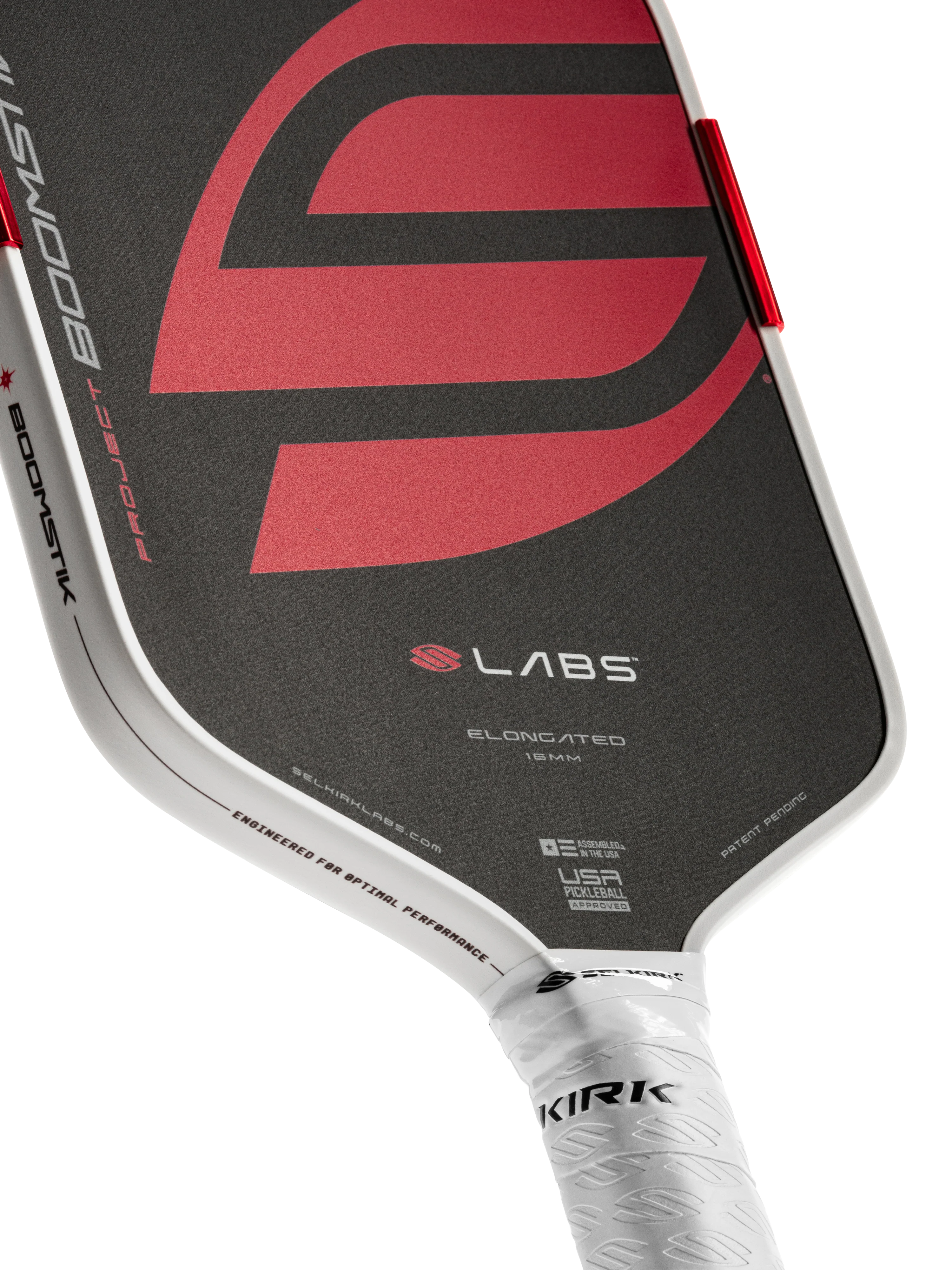 Close-up of a pickleball paddle with a red and black design on a white background