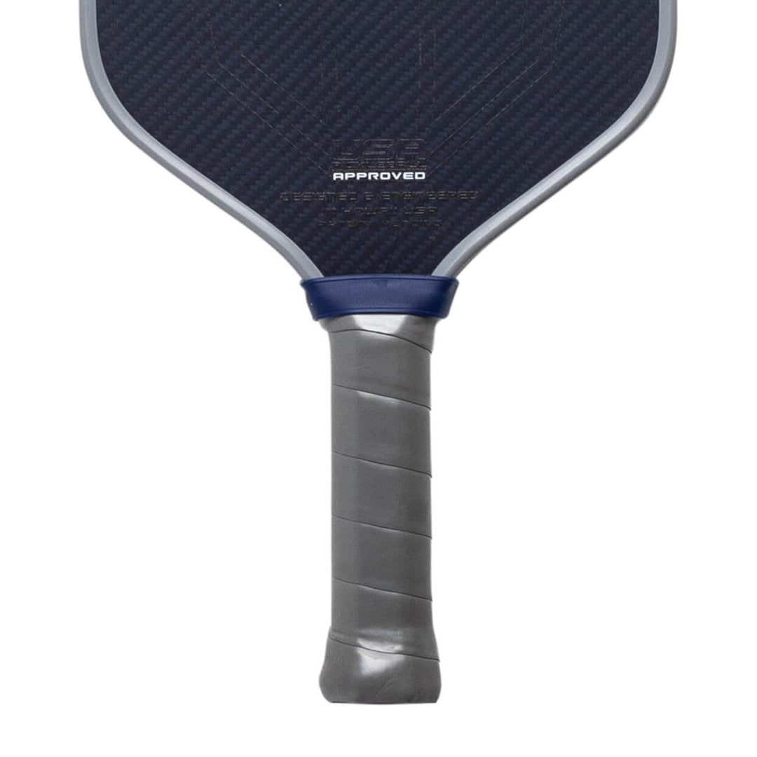 Close-up of a pickleball paddle with a blue and gray design on a white background