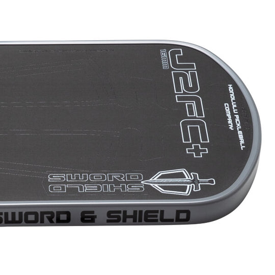 Black and gray pickleball paddle with 'Sword & Shield' branding on a white background