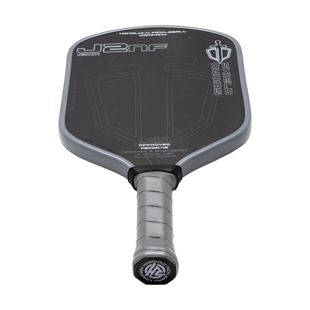 Pickleball paddle with branding on a white background