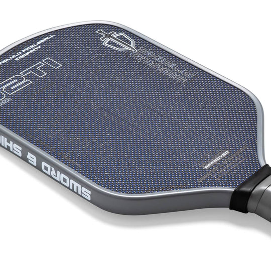 Close-up of a pickleball paddle with text and branding on a white background