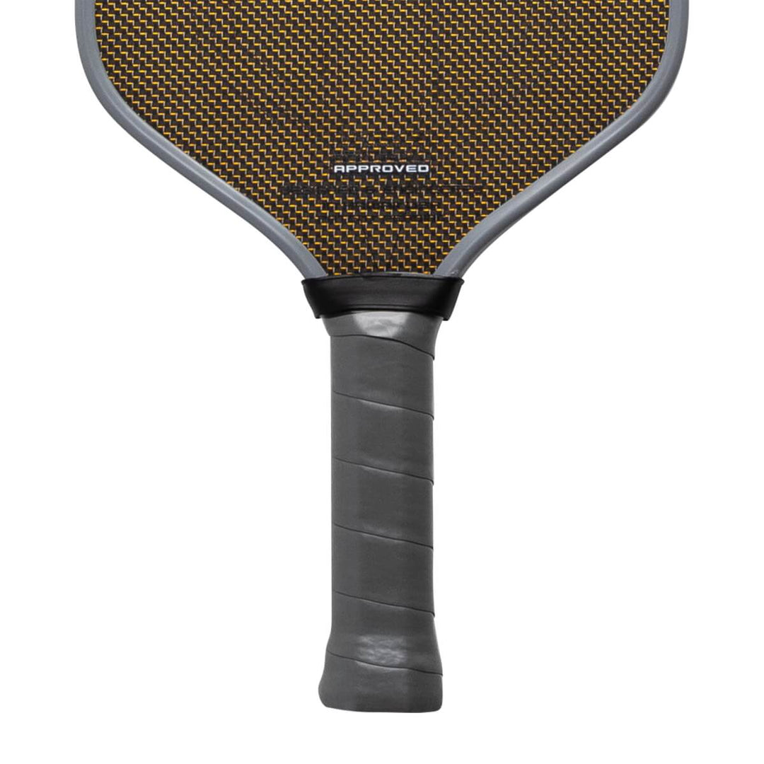 Pickleball paddle with brown surface and black handle on a white background