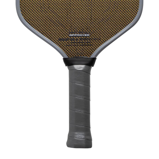 Pickleball paddle with brown surface and black handle on a white background